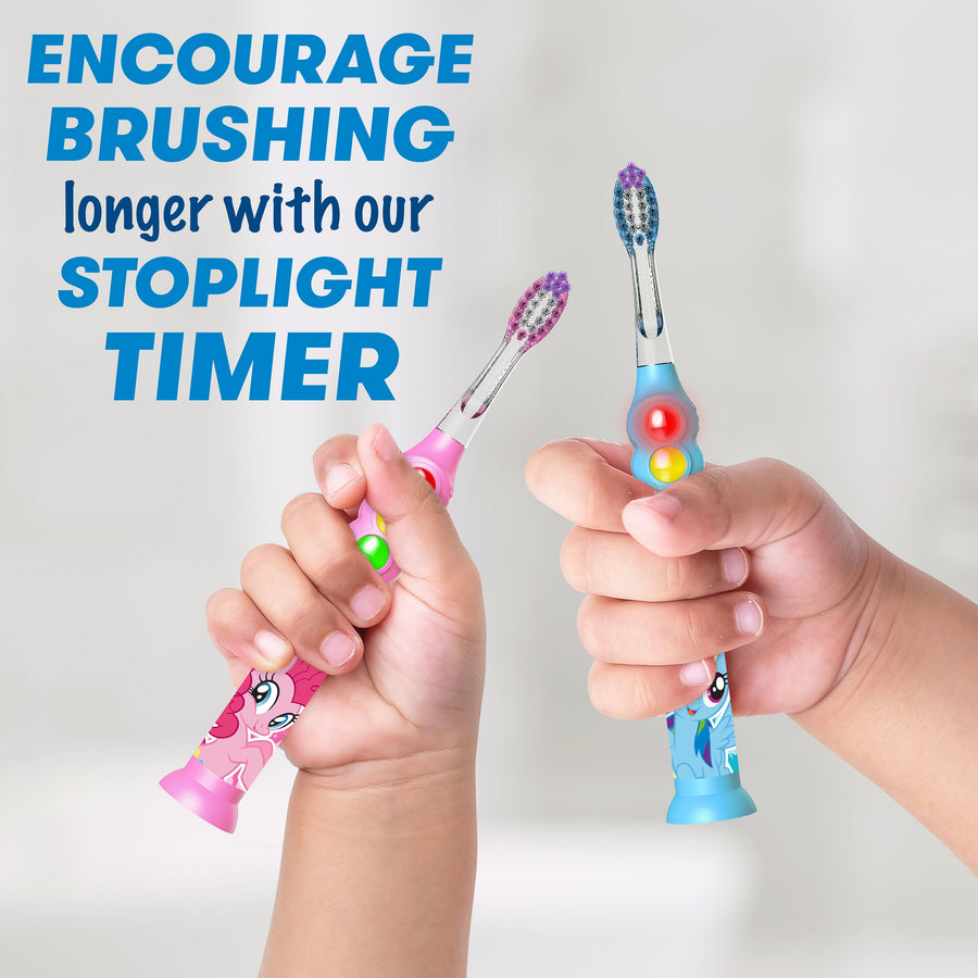 Children's hands holding My Little Pony Blue and Pink light up timer toothbrushes. Encourage brushing longer with our stoplight timer
