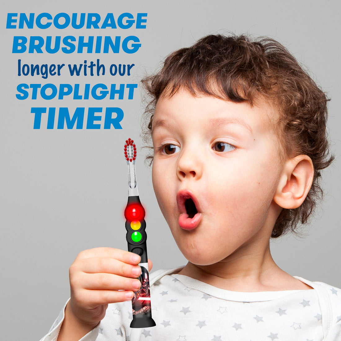 Child holding Star Wars Darth Vader Ready Go light up timer toothbrush. Encourage brushing longer with our stoplight timer