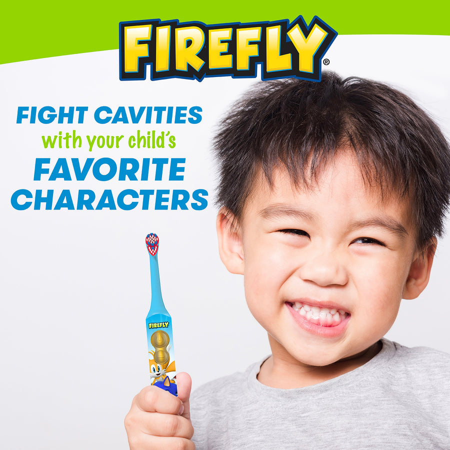 Boy holding Clean N' Protect Toothbrush. Fight cavities with your child's favorite characters