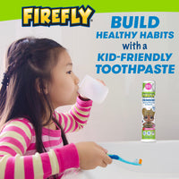 Child sipping a cup at the sink holding L.O.L. Surprise! Toothbrush, Build healthy habits with kid-friendly toothpaste
